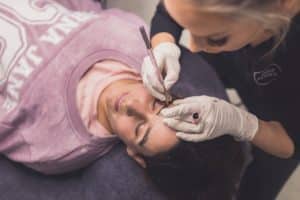 Cosmetic Tattooist Performing Microblading