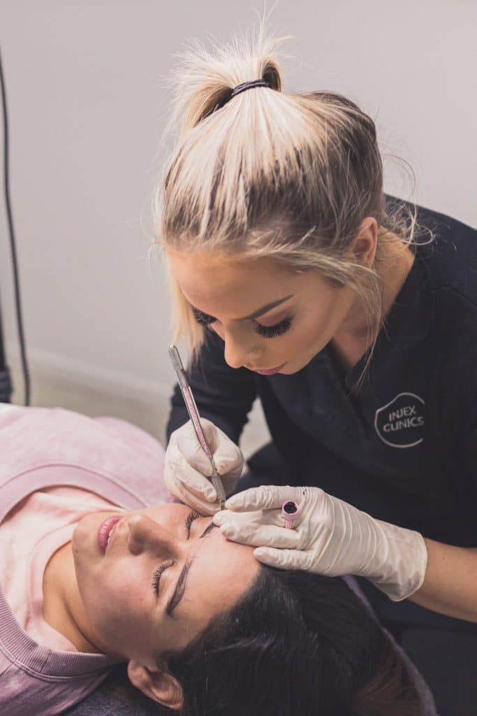 Cosmetic Tattooist Performing Microblading